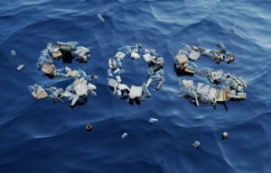 Plastic trash floating on the ocean spelling out SOS