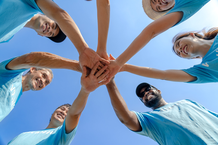 Thank you for volunteering Group of Clean Coast Crew volunteers in a circle celebrating